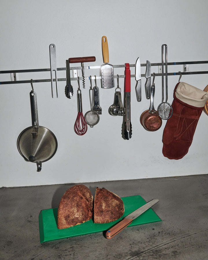 Kitchen utensils hanging on a Veark Magnetic Rack 