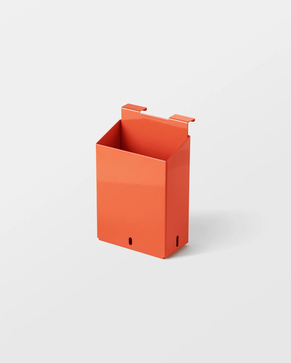 Veark Orange wall-mounted plant holder on a white background
